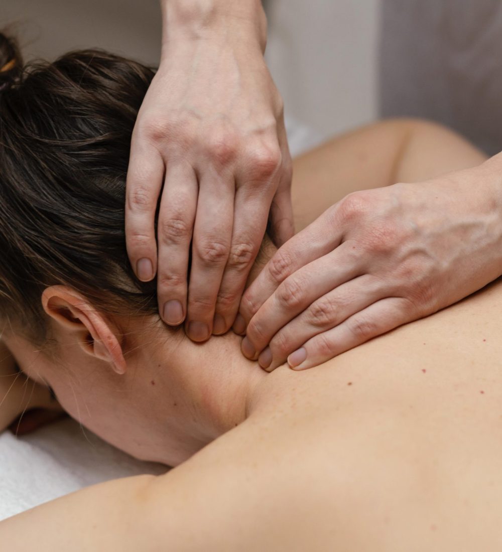 close-up-therapist-massaging-neck